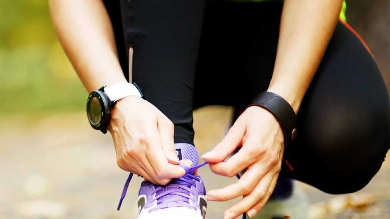Close up on a plate of mashed potatoes, topped with baked pork chops with cream of mushroom soup, and a side of green beans.
