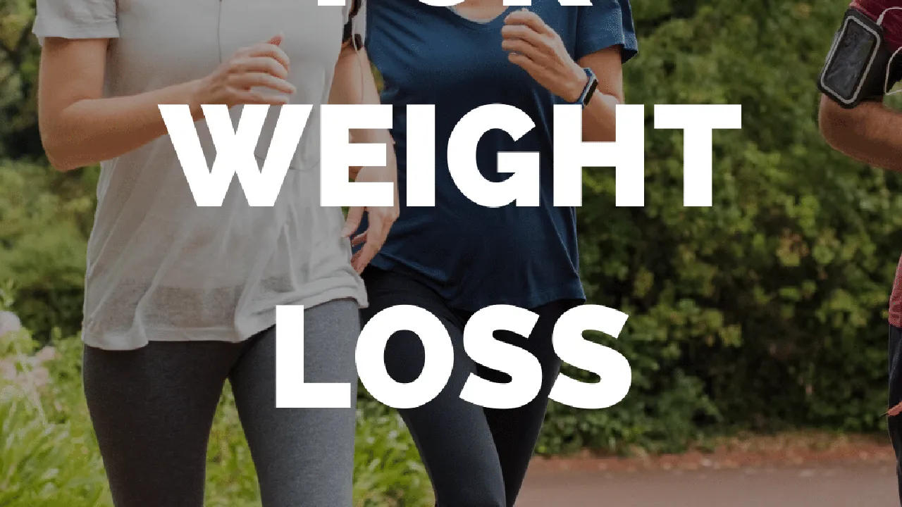 Close up on a plate of mashed potatoes, topped with baked pork chops with cream of mushroom soup, and a side of green beans.