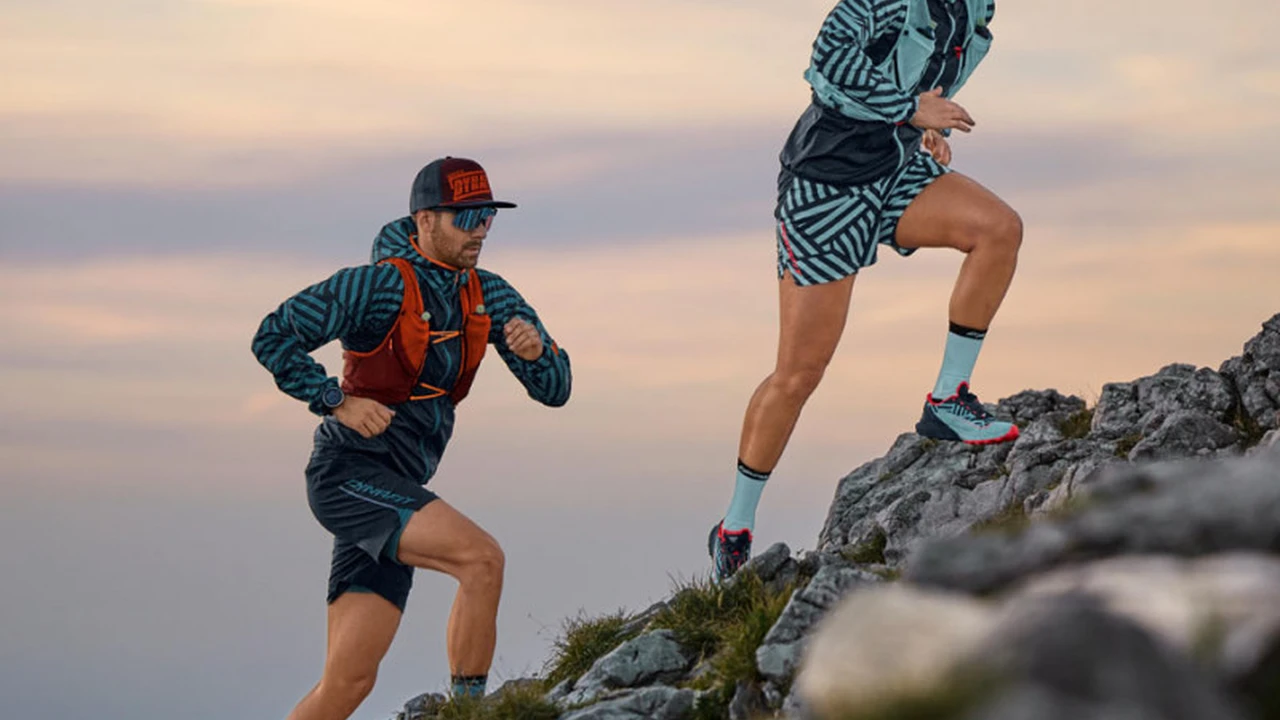 Close up on a plate of mashed potatoes, topped with baked pork chops with cream of mushroom soup, and a side of green beans.