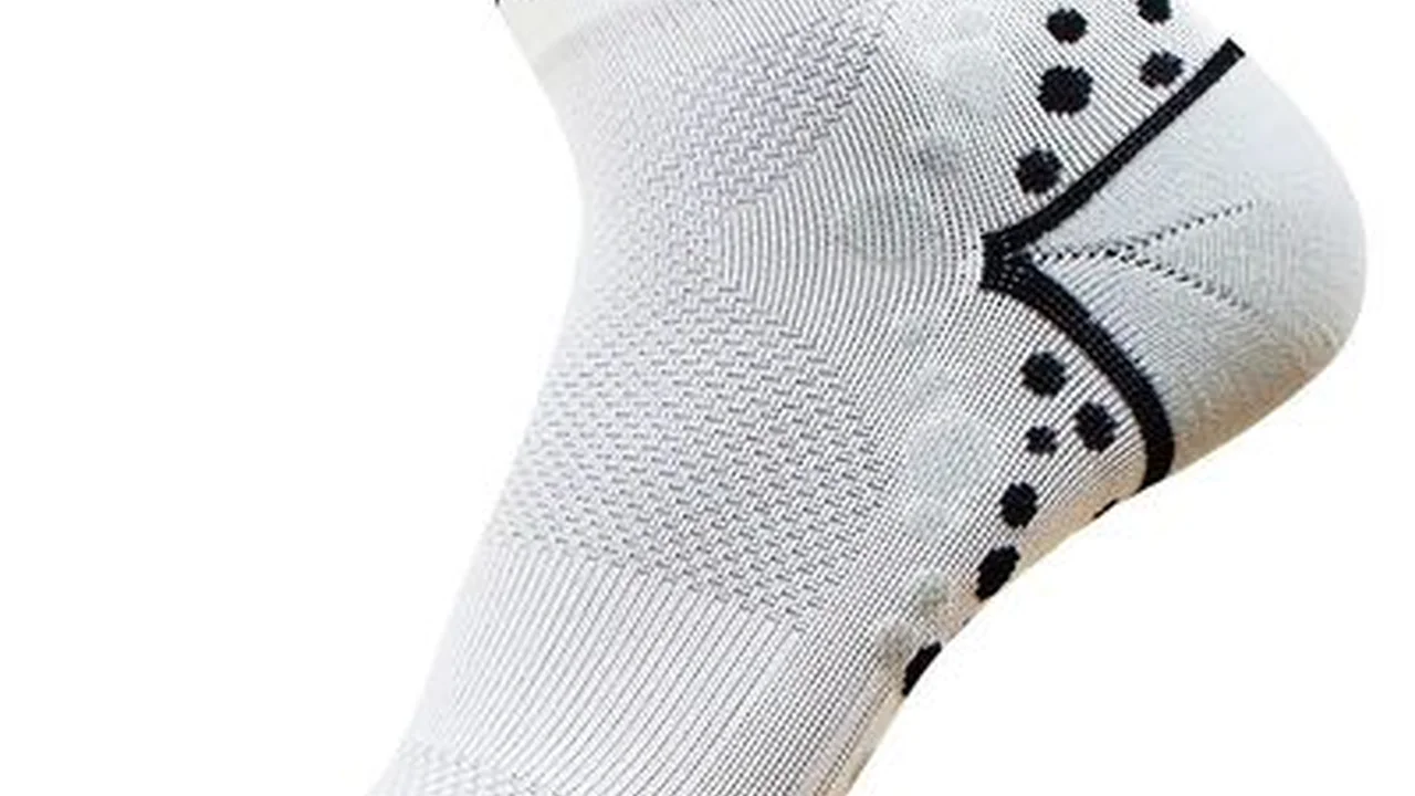 Close up on a plate of mashed potatoes, topped with baked pork chops with cream of mushroom soup, and a side of green beans.