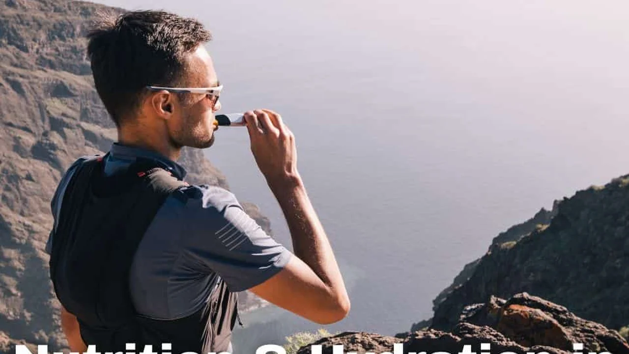 Close up on a plate of mashed potatoes, topped with baked pork chops with cream of mushroom soup, and a side of green beans.